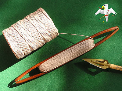 Coarse linen thread is being laid on a shuttle of pear wood. The amount seen here is not yet sufficient for the complete serving of one crossbow string.   © Falk 2007